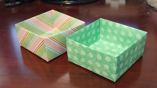 Make an origami box with matching lid out of scrapbooking paper with this paper craft tutorial.