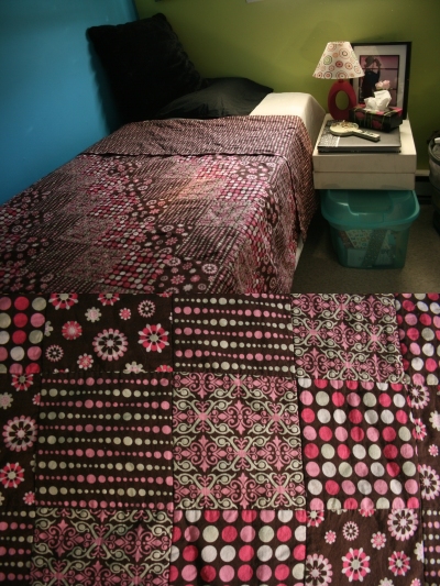 Craftcore pink and brown polka dot quilt - diagonal repeating pattern with square blocks  as shown in my dorm room
